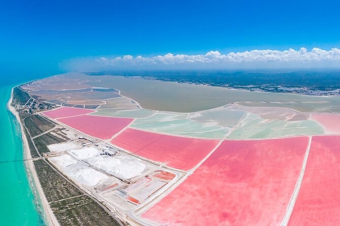 The salt pans at Las Coloradas from the air, pink and white rectangles against the Gulf