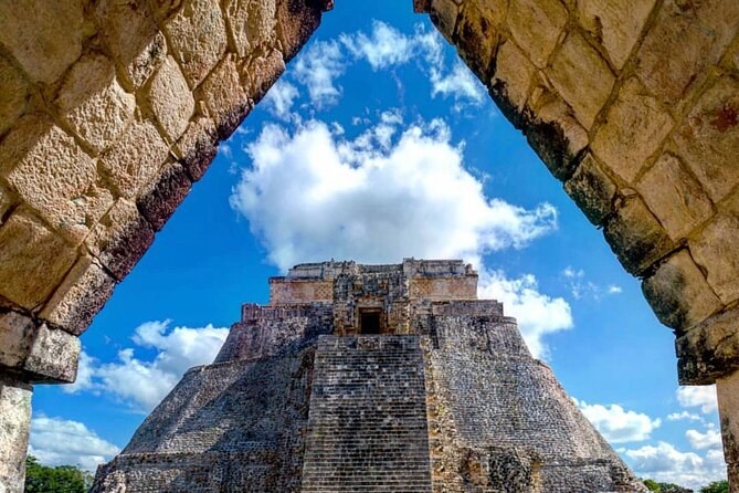 The Pyramid of the Magician at Uxmal framed by a Maya corbelled arch